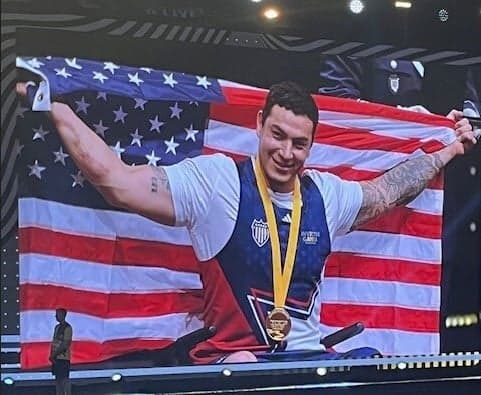 Athlete Jason Smith celebrating a medal win