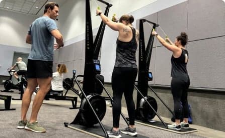 A trainer giving advice on how to use the SkiErg