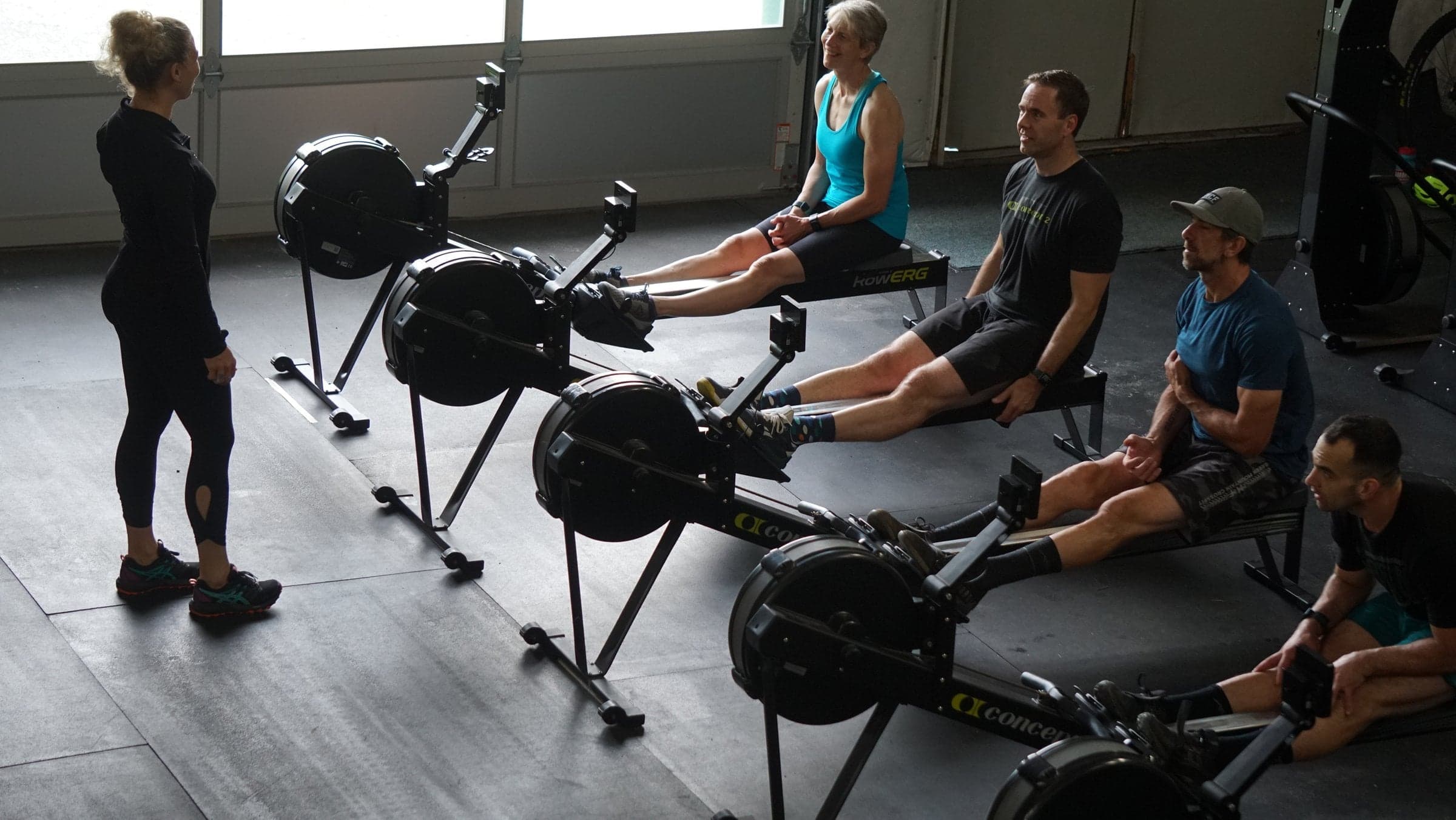 Instructor Teaching Rowing to Students
