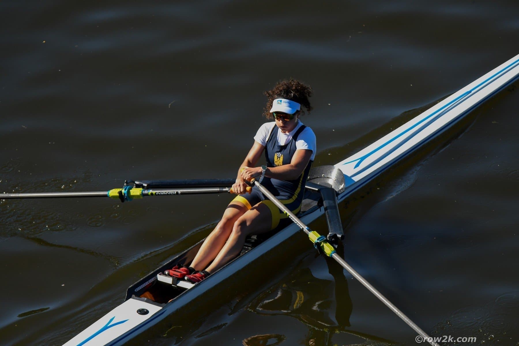 Woman rowing single with Concept2 oars